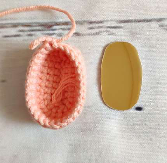 Lining up the crochet arm to attach it to the body