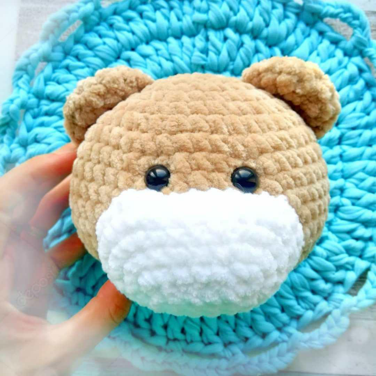 Pinning the muzzle in place before sewing it onto the teddy bear head