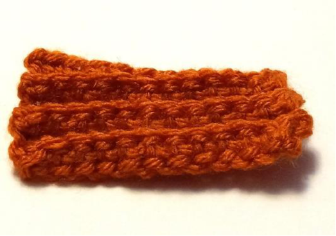 A close-up of the ribbed texture created by working single crochet stitches in the back loop only.