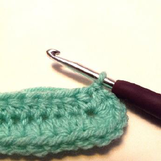 Step 5: Joining the first round with a slip stitch to complete the oval shape.