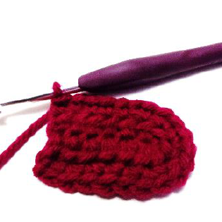 Final single crochet stitches completing a crochet row