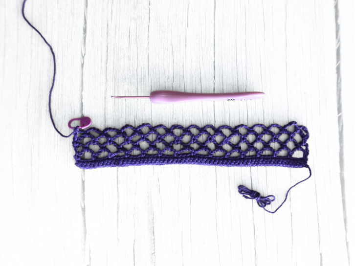Crocheting the diamond mesh stitch pattern for the body of the bag.