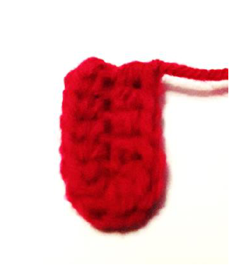 The small red crocheted tongue piece.