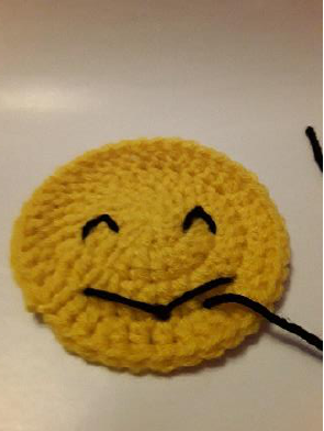 Securing the yarn on the back.