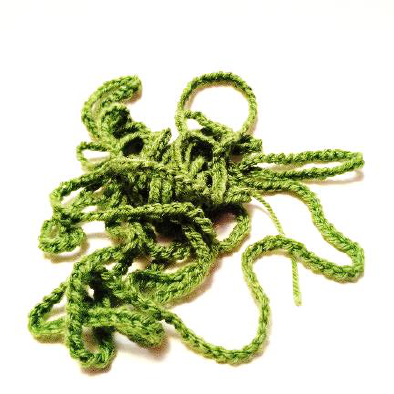Pile of green crochet chain stitches for wreath base
