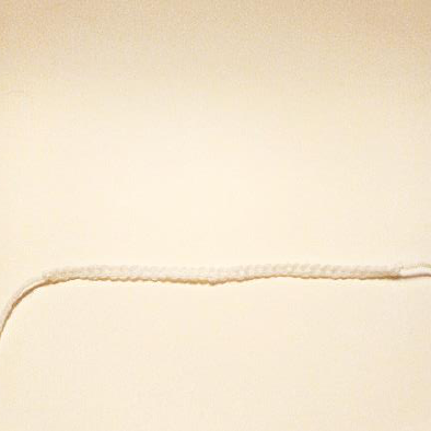 Close-up of a white crochet chain for the spider web