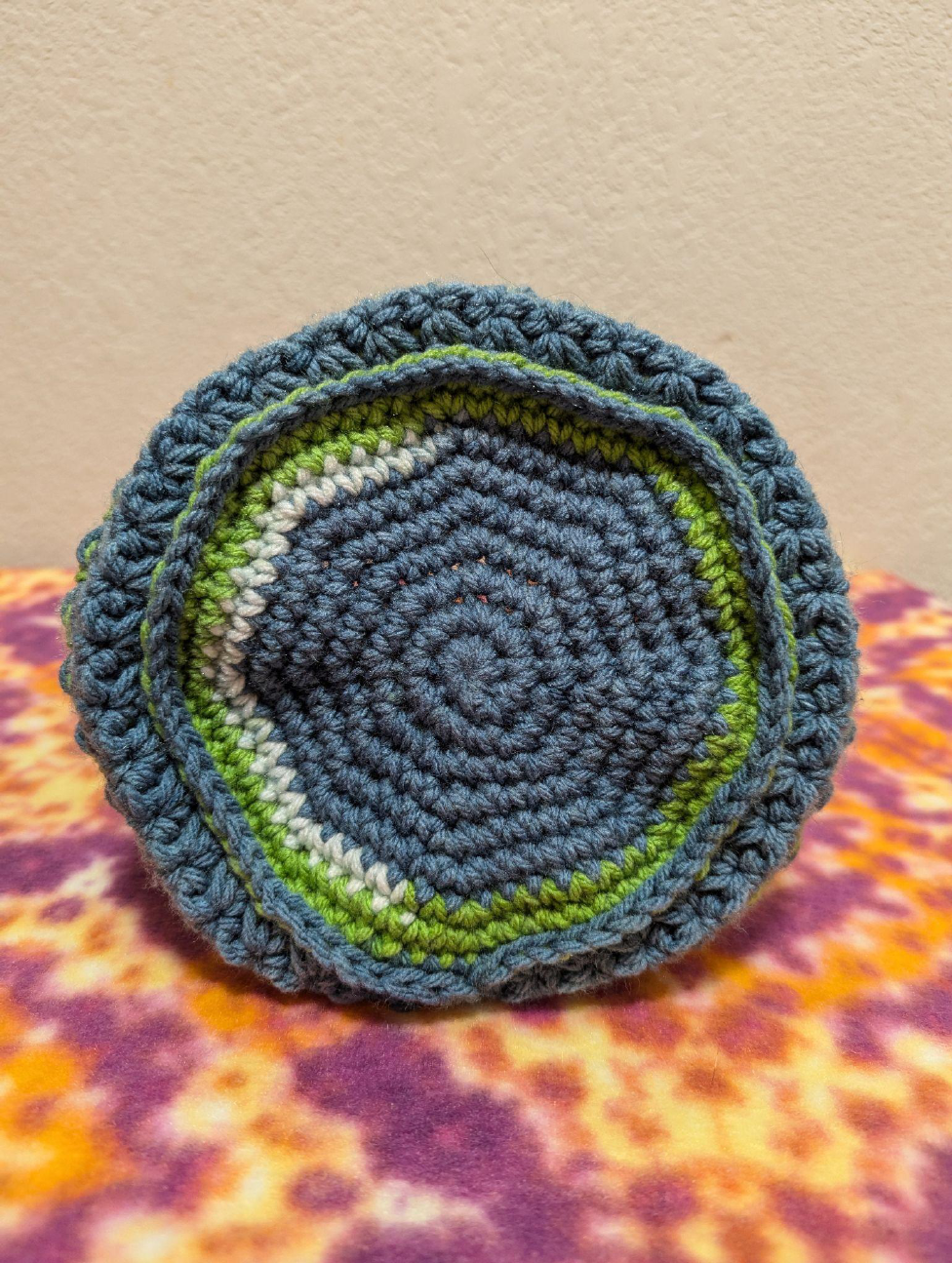 The base of the crochet bag after round 8.