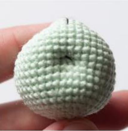 Crocheted bunny head before facial features
