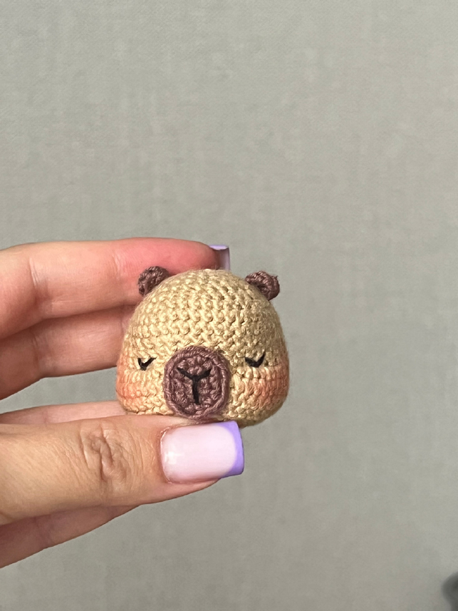Crochet orange sewn to the capybara's head