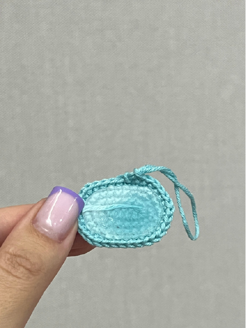 Crochet body pinned to the head, aligning markers