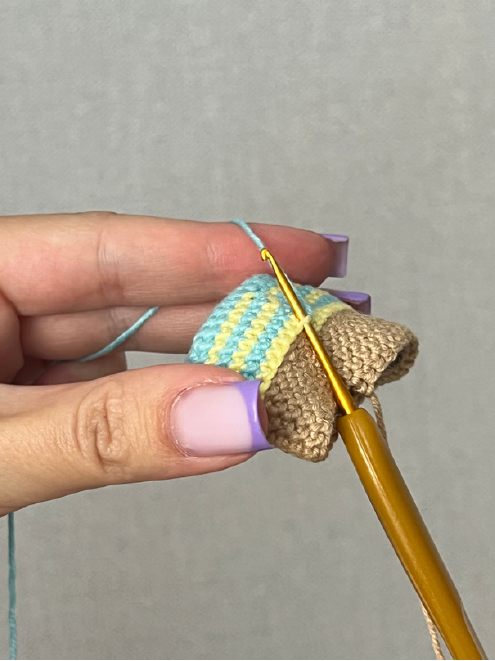 Crochet legs pinned to the lower body