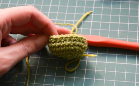 Mid-section of the crocheted leg in olive green