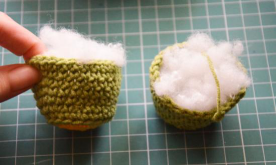 Crocheted head positioned for attachment to the body