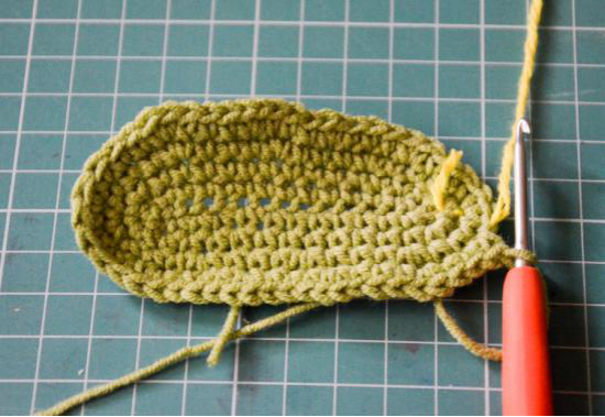Partially crocheted olive green ear