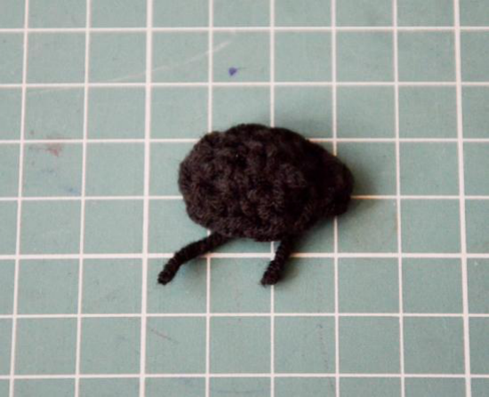 Mid-section of the crocheted olive green hand