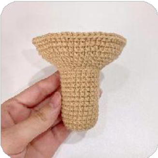 Two small, dark brown crocheted leg-like pieces for the capybara's front legs.