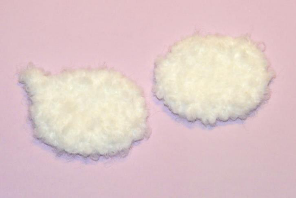 Various crochet sheep parts in different colors