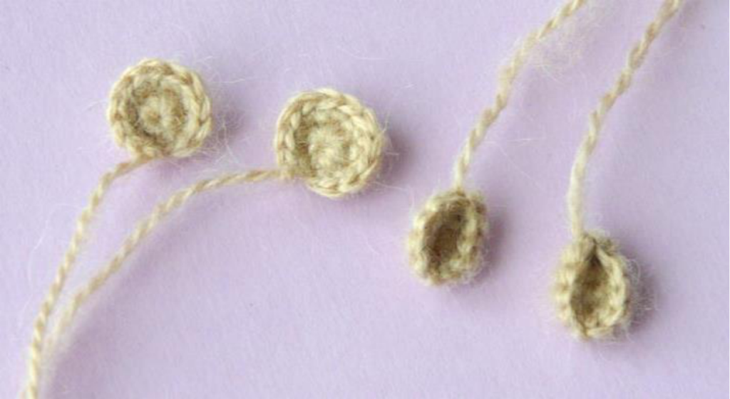 Close-up of a crocheted sheep body with a small tail