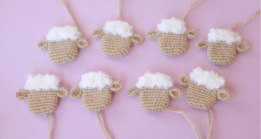 Crocheted sheep head's smooth yarn section forming the face