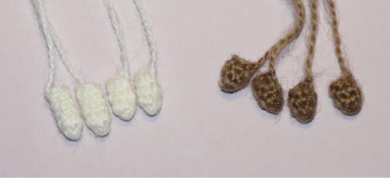 Crochet sheep head with embroidered face and eyes