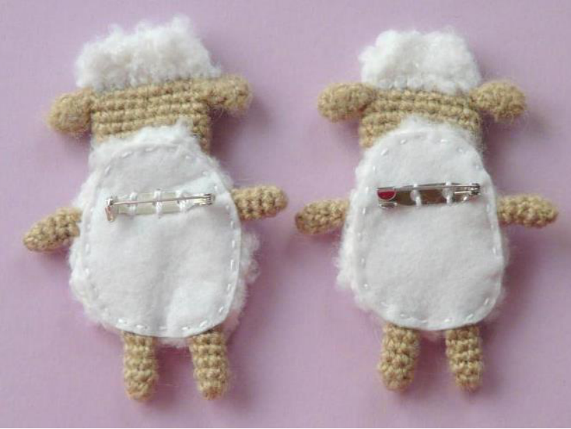 Sewing the stuffed crochet sheep body closed with an overcast stitch